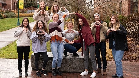 group of SPSY Eugene Cohort 2022 students signing the University of Oregon O