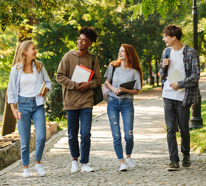 Group of students walking and laughing