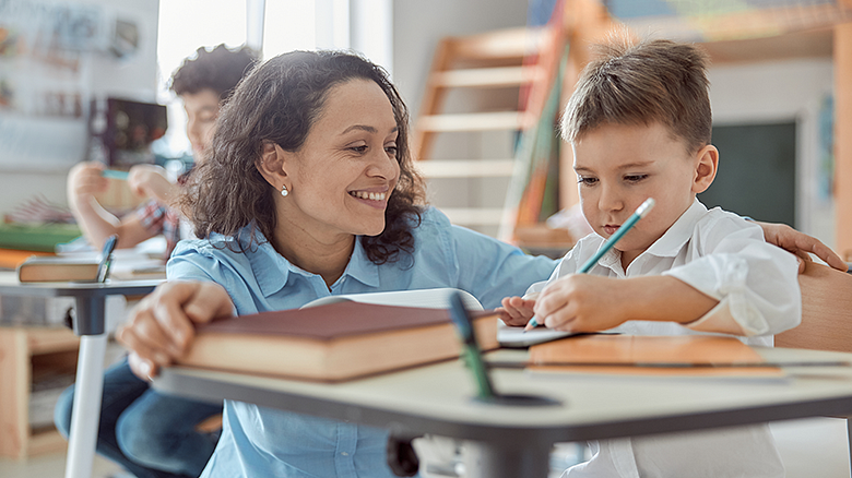 Teacher with elementary student