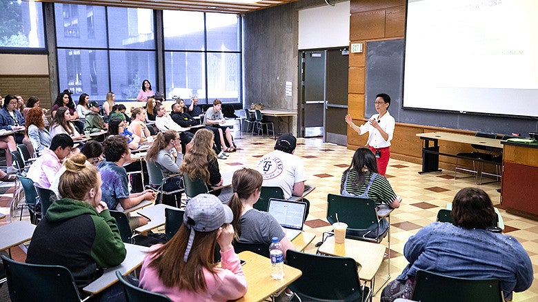 Classroom of students with a person leading a discussion