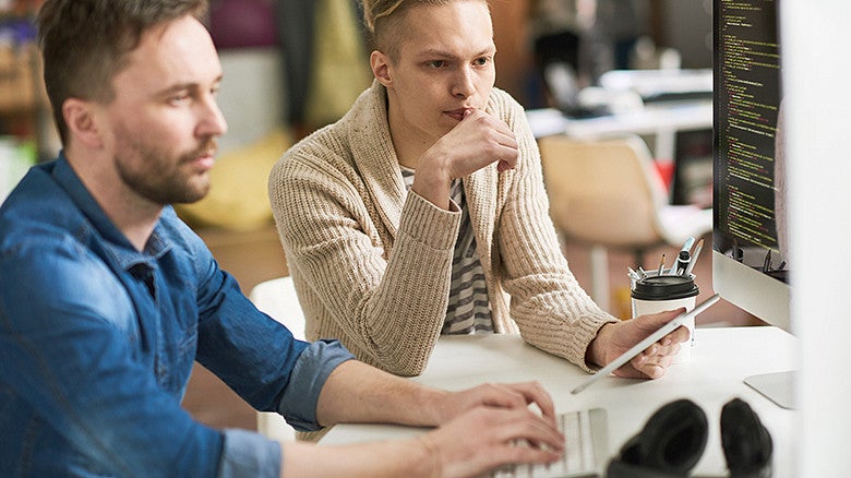 EDUC students looking at a computer screen