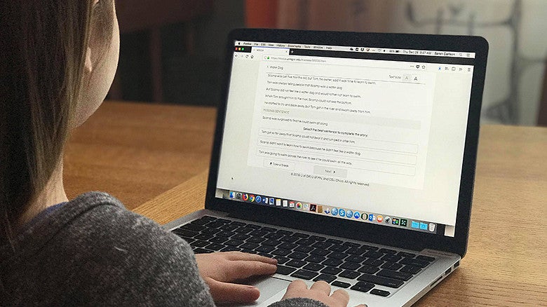 image of young person working on a laptop