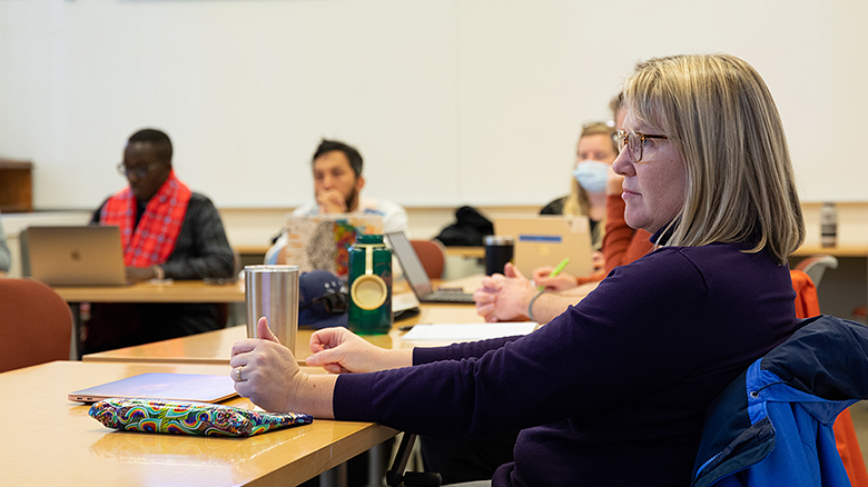 image of EPoL students in classroom looking at professor