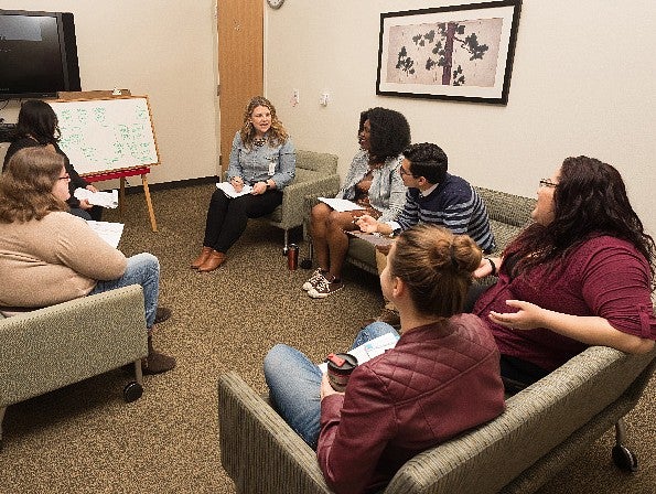 image of couples and family therapy students sitting and talking