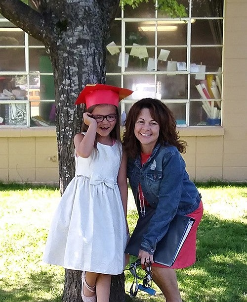 image of Jennifer Christmas and a younger individual posing for camera