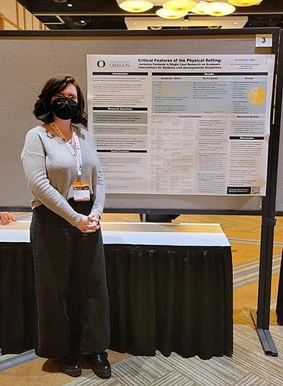 Sarah Quinn standing in front of research poster