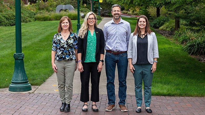 Dean's Department Heads group standing facing camera