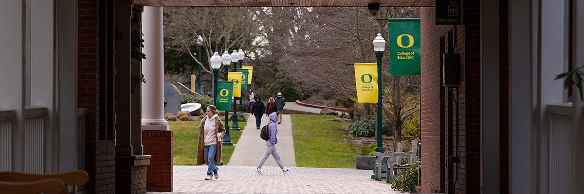 students in the distance walking around HEDCO from view from Lokey