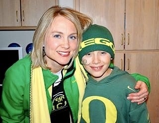 Susan Coleman and child posing facing camera