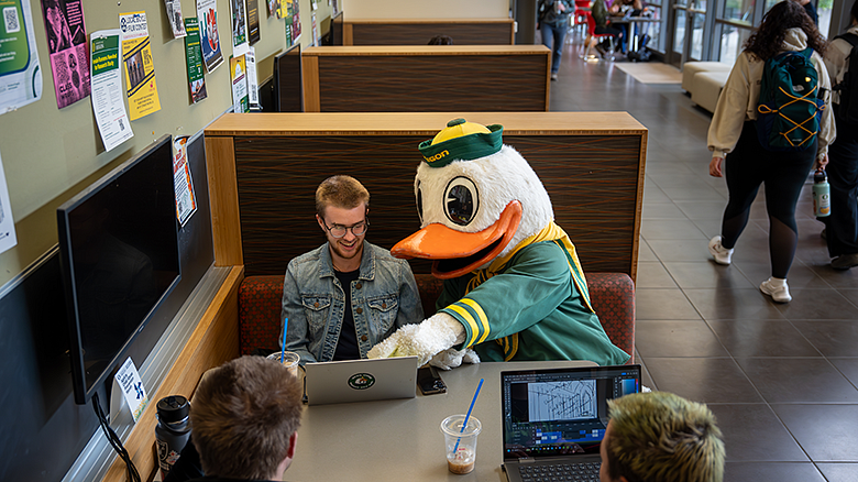 Oregon Duck helping students in the HEDCO lobby study area
