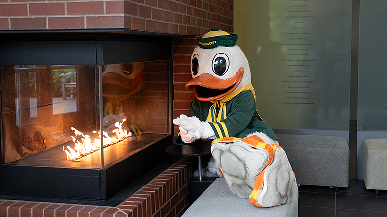 Oregon Duck reflecting by the HEDCO lobby fireplace
