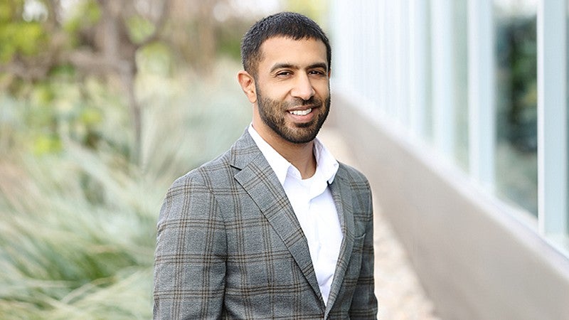 Dr. Shaji S. Haq facing camera smiling