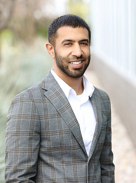 Dr. Shaji S. Haq facing camera smiling