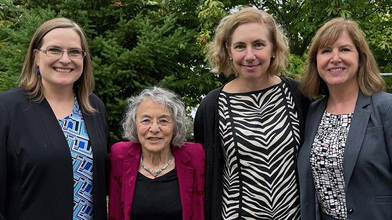 Emily Tanner-Smith, Judith Eisen, Karen Guillemin, and Leslie Leve facing the camera and smiling