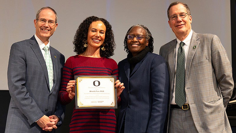Rhonda Nese, PhD accepting an award