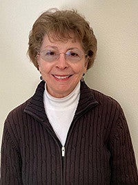 Diane Bricker posing for a camera photo facing forward and smiling