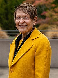 Jane Squires smiling at camera for a head shot