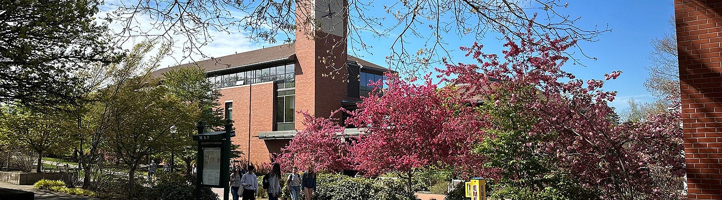 HEDCO building shot from afar with students walking in the foreground