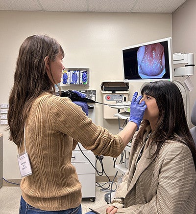 Sierra Corbin and students in a clinical setting
