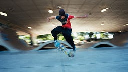 image of a person doing a flip trick on a skateboard