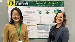 image of Stephanie Shire and a student in front of a research poster