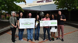 Nate Jackson receiving award for Oregon Lottery Regional Teacher of the Year