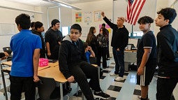 group of English learning students in a classroom with a teacher
