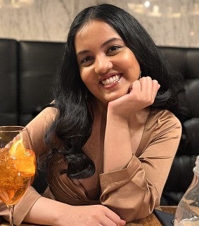 student Gauri Bharadwaj smiling towards camera
