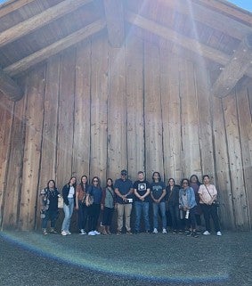 Kevin Simmons and 2023 Sapsikwala Cohort in front of the Plankhouse on the Grand Ronde Indian Reservation