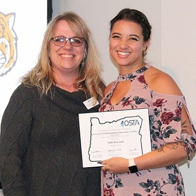 COE UOTeach student teacher receiving an award