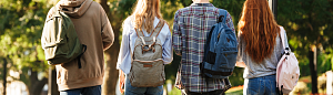UO students facing backwards showing backpacks