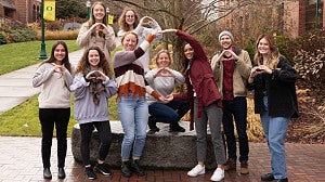 group of SPSY Eugene Cohort 2022 students signing the University of Oregon O