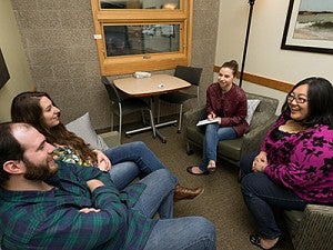 A group of people in a therapy session