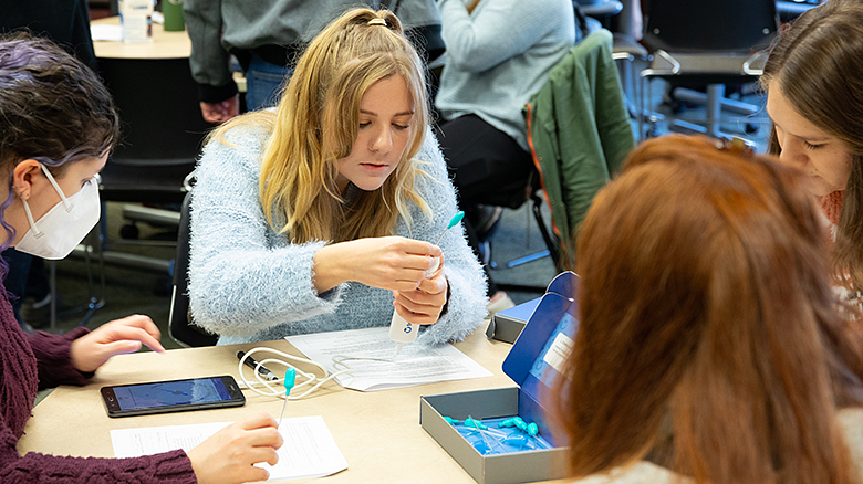 image of CDS program students at table working on projects