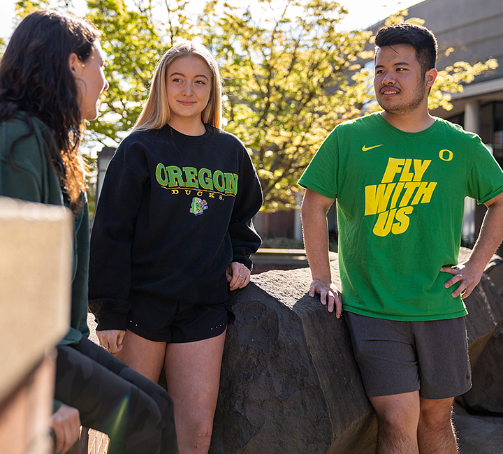 image of individuals talking outside of UO rec center