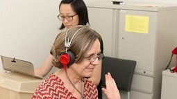 University of Oregon College of Education student conducting a hearing test