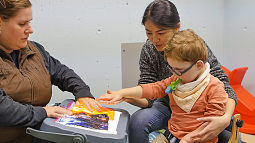 University of Oregon College of Education SPED student with professor and child University of Oregon College of Education SPED student with professor and child